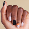 Nails with Halloween-themed nail art on LED Gel Strips