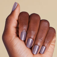 Hand with purple glitter LED gel strip