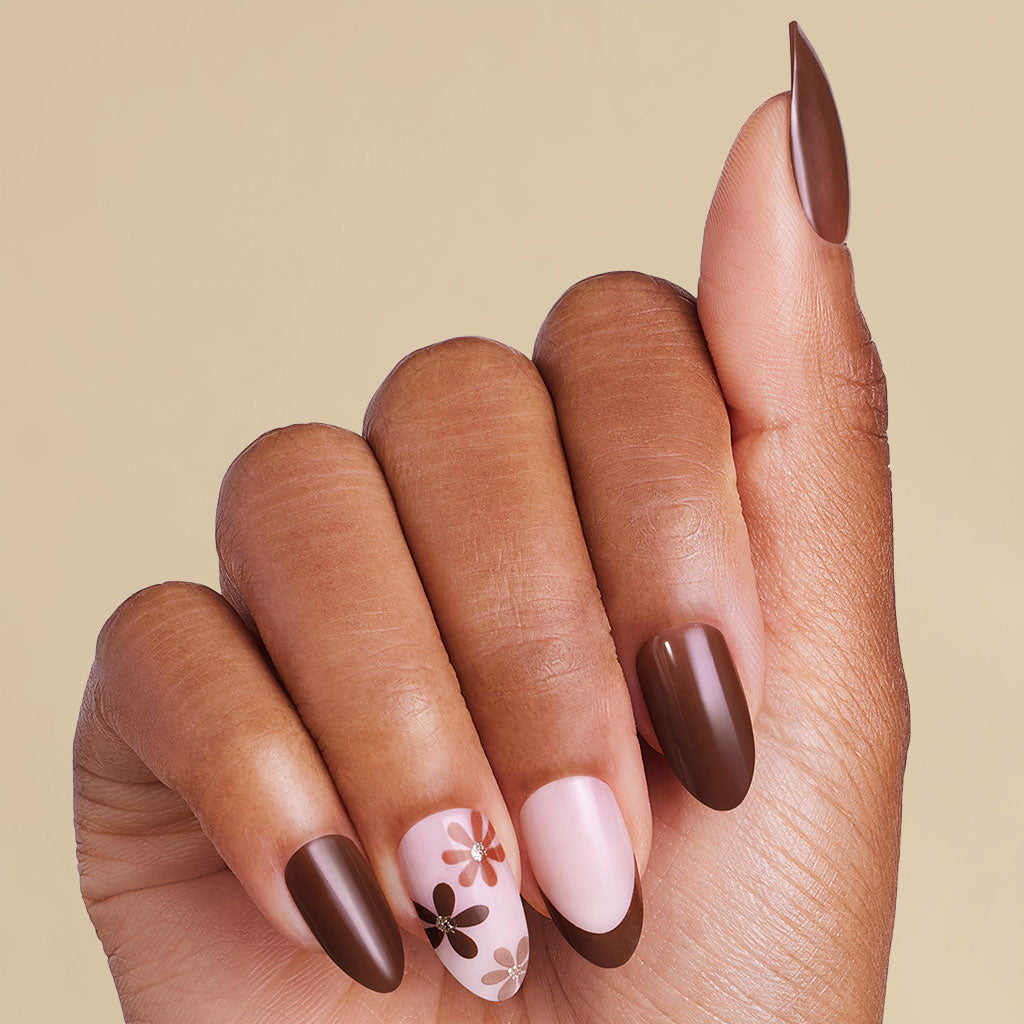 Hand with brown french coffin press on nails
