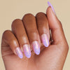 Hand with gradient ombre pink and purple coffin press on nails