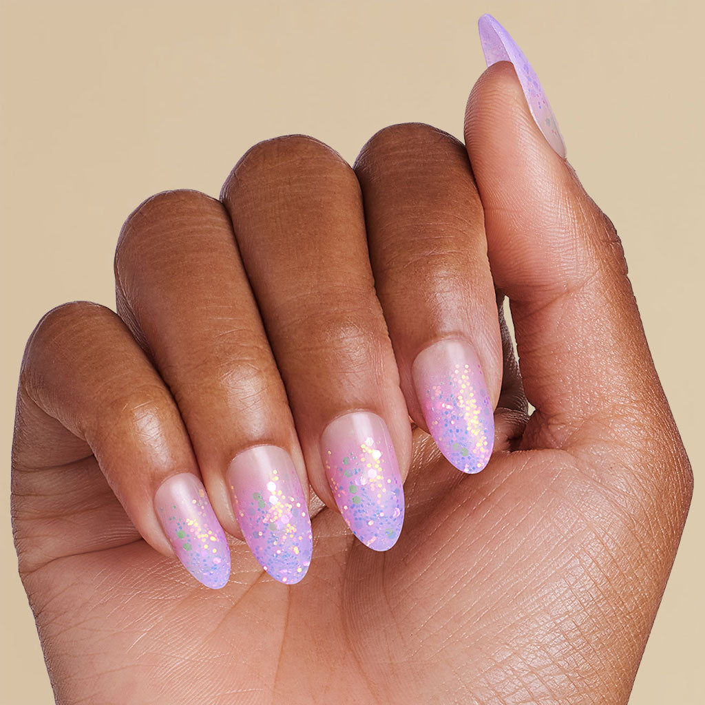 Hand with gradient ombre pink and purple coffin press on nails